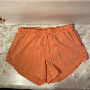 Nike Running Dri-fit XS Corral orange shorts